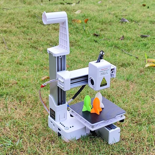 Vista 5 de Impresora 3D para principiantes, tamaño compacto, alta resolución, calefacción eficiente, diseño robusto, para proyectos educativos, color blanco