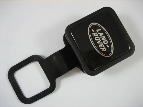 Vista 2 de Cubierta del Enchufe del Enganche de Remolque con Logo Genuino de Land Rover con Cordón