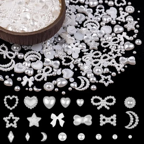 Vista 7 de 600 piezas de dijes de uñas 3D de múltiples formas y perlas planas, estilos mixtos blanco y rosa, corazones, estrellas, lazos, girasoles, adornos