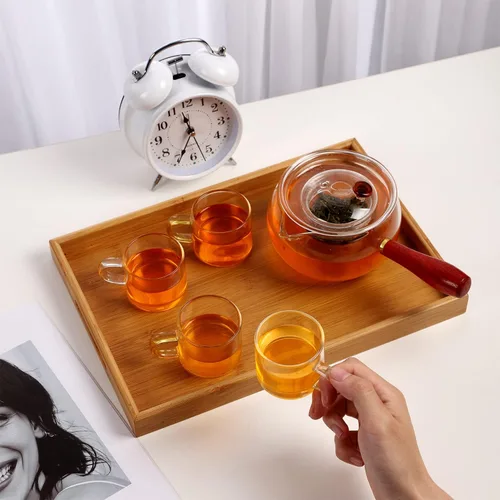 Vista 3 de WHJY Tetera de vidrio con infusor para té suelto, pequeña tetera mágica transparente para estufa, tetera japonesa transparente con mango de madera