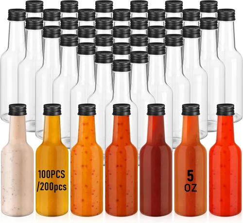 Zubebe 100 botellas de salsa picante, pequeñas botellas de plástico transparente Woozy vacías con tapa de rosca negra a prueba de fugas, mini tarros
