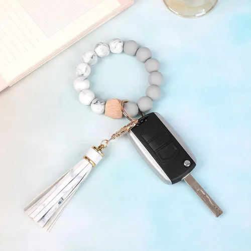 Vista 3 de BAOSIWA Pulsera de cuentas de silicona con llavero de pulsera para mujer con borla de cuero