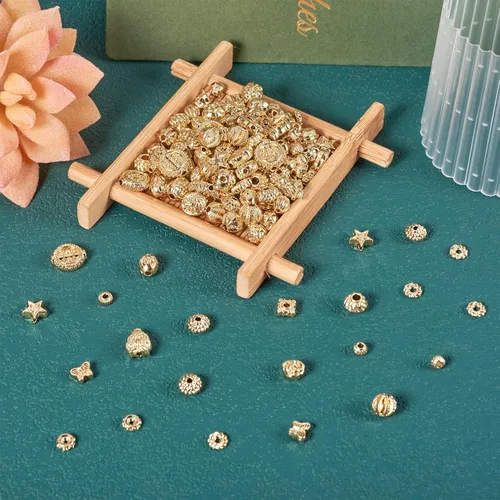 Vista 8 de Craftdady 180 cuentas espaciadoras de aleación, cuentas occidentales, cuentas tibetanas de oro claro, surtidas, cuentas de estrella Rondelle