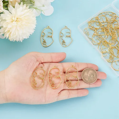 Vista 3 de SUNNYCLUE 1 caja de 30 dijes de cara humana con bisel de espalda abierta, dijes abstractos dorados en blanco con marco de resina hueca de doble